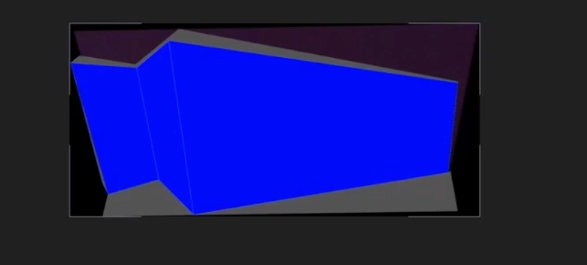 A low-poly 3D block model represents the main building façade, rendered in solid blue to test projection layout and spatial proportions.